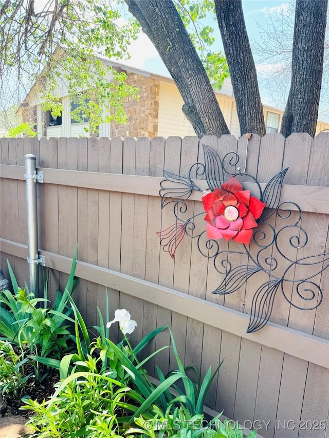 exterior details featuring fence