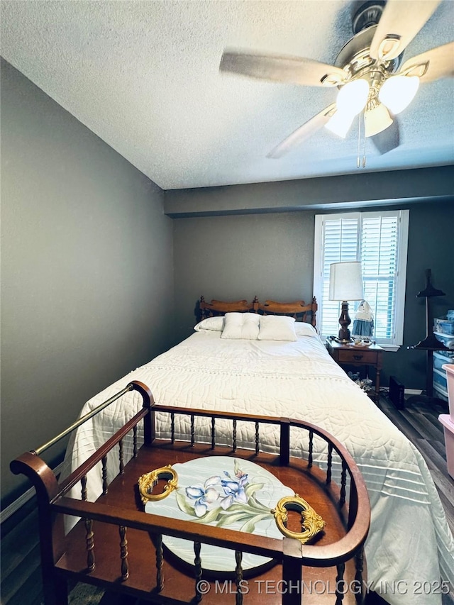 6371 S 80th E Ave Unit 6H, Tulsa, OK 74133 - bedroom with a textured ceiling, wood finished floors, and ceiling fan