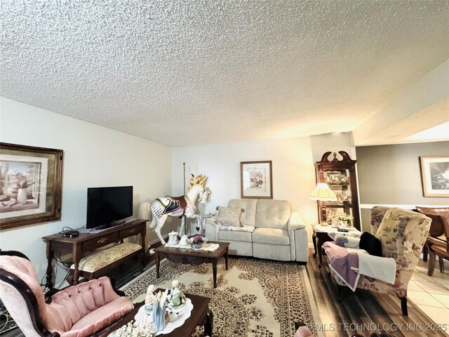 6371 S 80th E Ave Unit 6H, Tulsa, OK 74133 - living area featuring a textured ceiling and wood finished floors