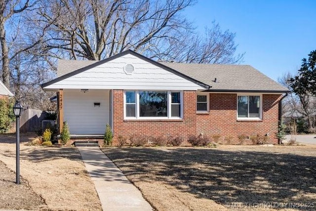 view of front facade featuring crawl space and brick siding