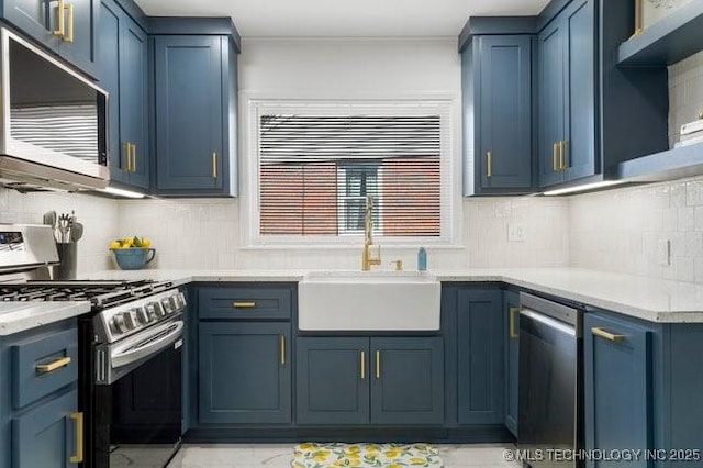 kitchen with open shelves, tasteful backsplash, appliances with stainless steel finishes, a sink, and blue cabinets