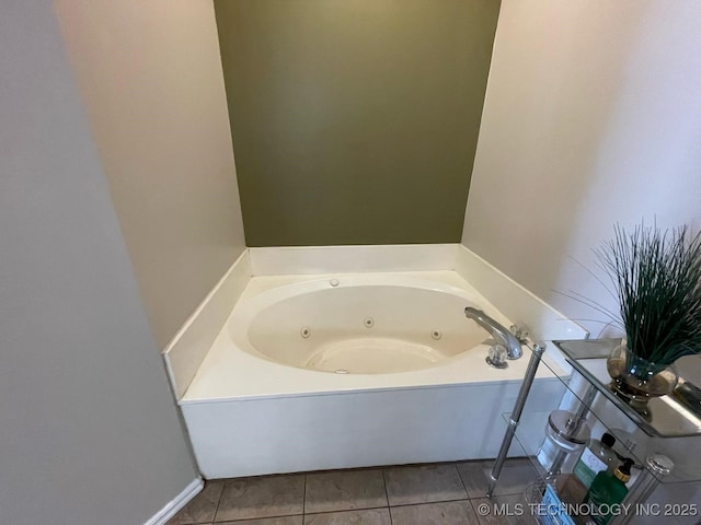 full bathroom with tile patterned flooring and a tub with jets