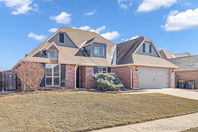 view of front of home with brick siding, a shingled roof, concrete driveway, an attached garage, and a front lawn