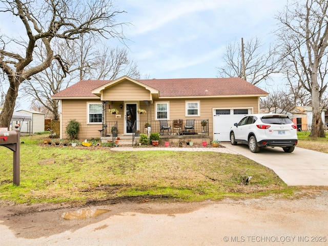 ranch-style home with a garage, driveway, and a front yard