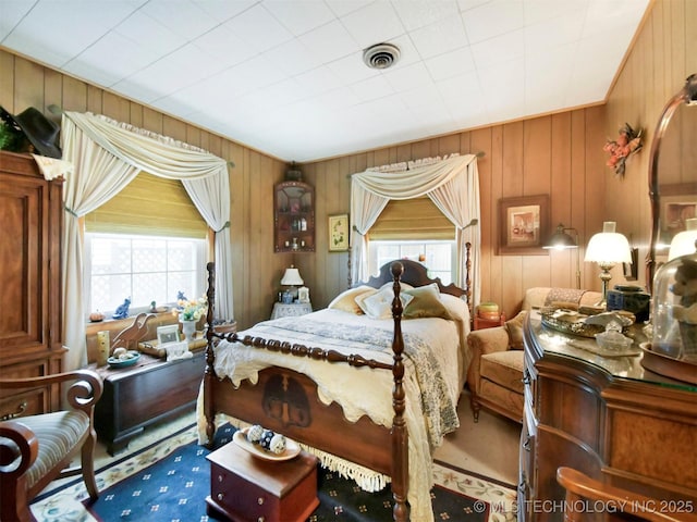 bedroom featuring multiple windows and visible vents