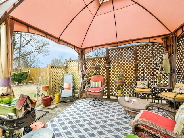 view of patio featuring a gazebo and fence