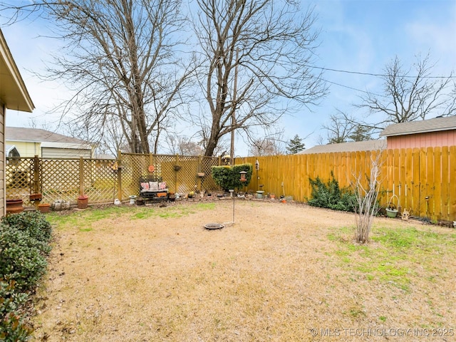 view of yard with a fenced backyard