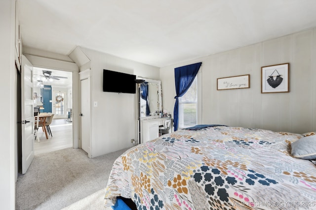 bedroom featuring light colored carpet