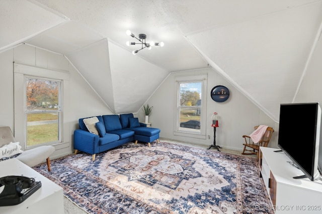 living area featuring a wealth of natural light and lofted ceiling