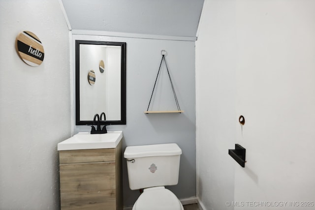 half bath with vanity and toilet