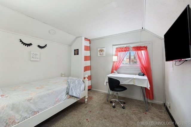 bedroom with lofted ceiling, carpet floors, and baseboards