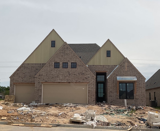 2513 W Twin Oaks St, Broken Arrow, OK 74012 - view of front of home with brick siding, an attached garage, and cooling unit