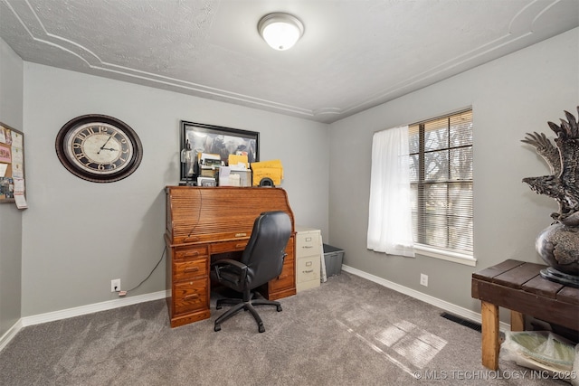 carpeted office space featuring baseboards, visible vents, and a textured ceiling