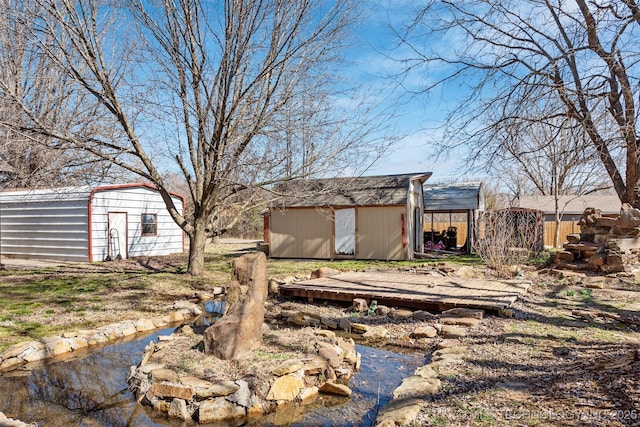 view of yard featuring an outbuilding and a storage unit