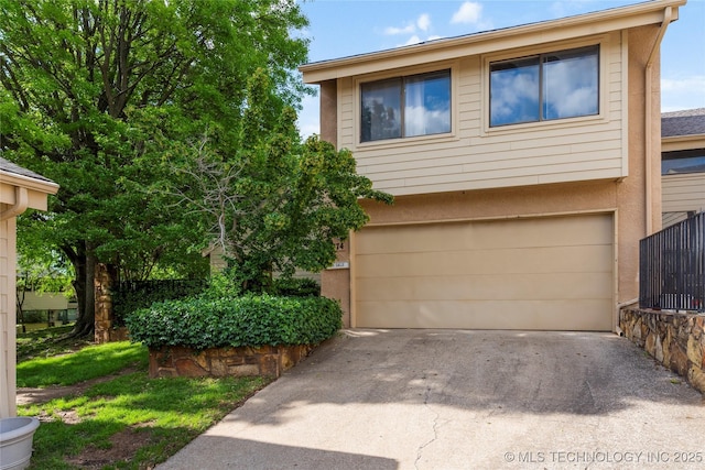 view of front facade with an attached garage and driveway