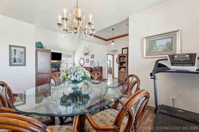 2445 Avalon, Eufaula, OK 74432 - dining area with a chandelier, baseboards, wood finished floors, and vaulted ceiling