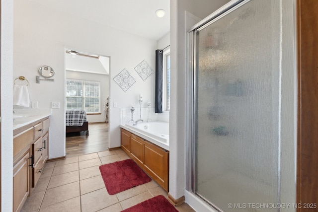 ensuite bathroom with a shower stall, ensuite bath, a bath, and tile patterned floors