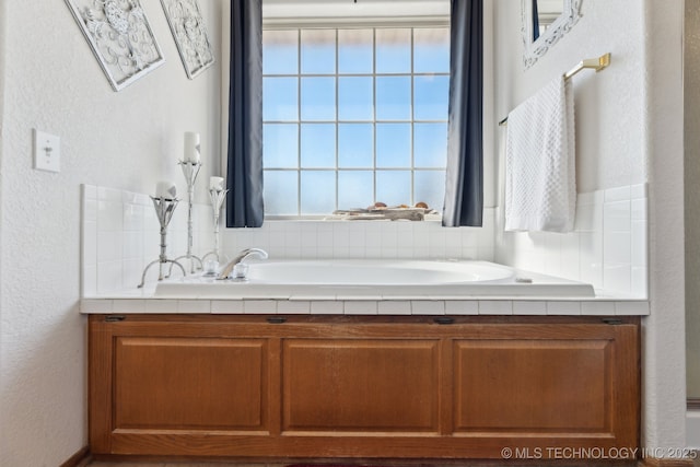 2445 Avalon, Eufaula, OK 74432 - bathroom with a garden tub and a textured wall
