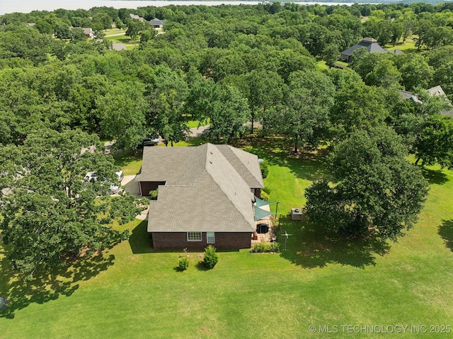 2445 Avalon, Eufaula, OK 74432 - aerial view of property and surrounding area featuring a heavily wooded area