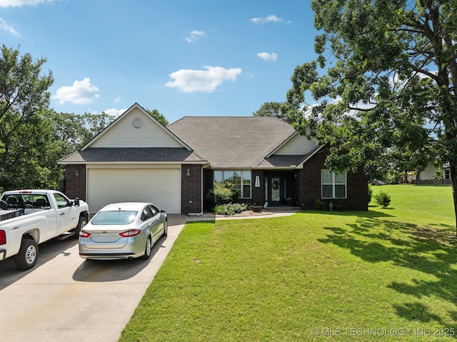 2445 Avalon, Eufaula, OK 74432 - view of front facade with driveway, a garage, brick siding, and a front lawn