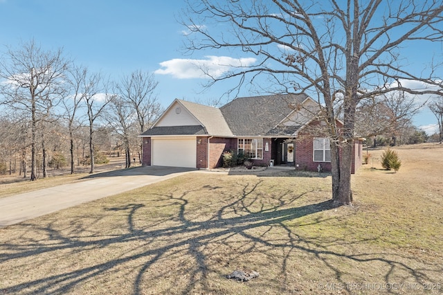 view of front facade featuring brick siding, a shingled roof, a front yard, a garage, and driveway