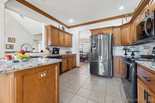 kitchen with brown cabinetry, range with electric cooktop, stainless steel refrigerator with ice dispenser, and light stone counters