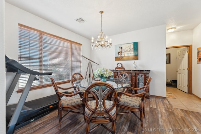 2445 Avalon, Eufaula, OK 74432 - dining area with a chandelier, wood finished floors, and baseboards
