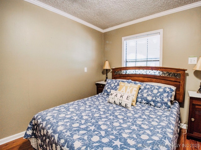 bedroom featuring crown molding, dark wood finished floors, and a textured ceiling