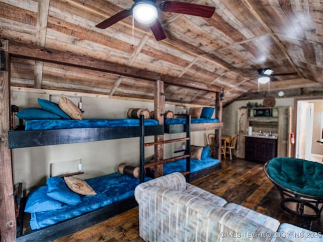 bedroom featuring wood ceiling, dark wood-style flooring, and vaulted ceiling