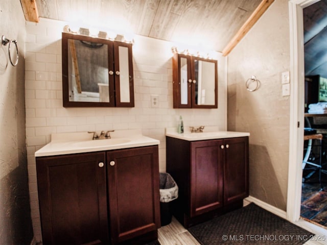 bathroom with two vanities and a sink