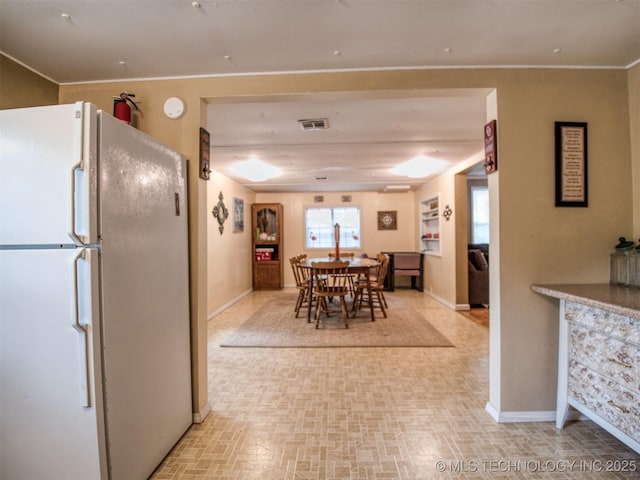 dining area featuring visible vents and baseboards