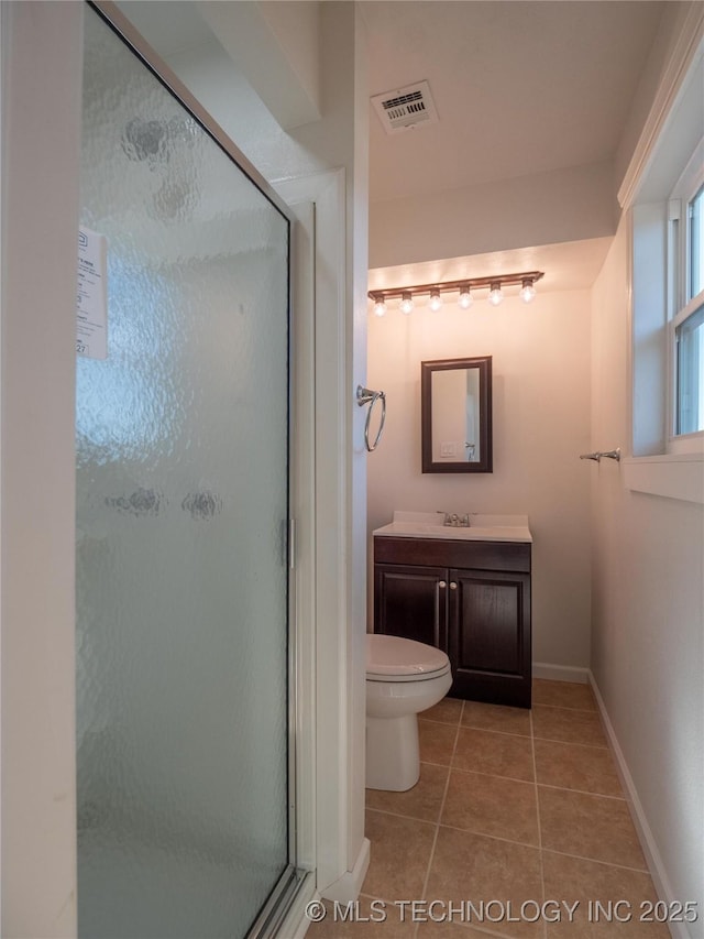 full bathroom with vanity, baseboards, visible vents, a shower stall, and tile patterned floors