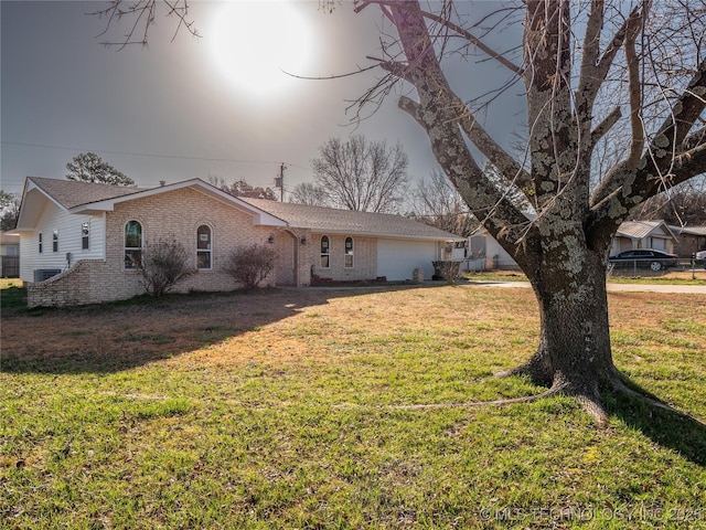 single story home featuring a front lawn and brick siding