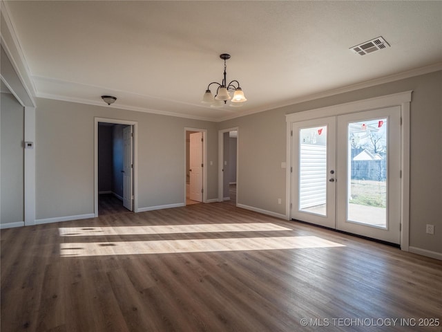 interior space featuring ornamental molding, french doors, visible vents, and wood finished floors