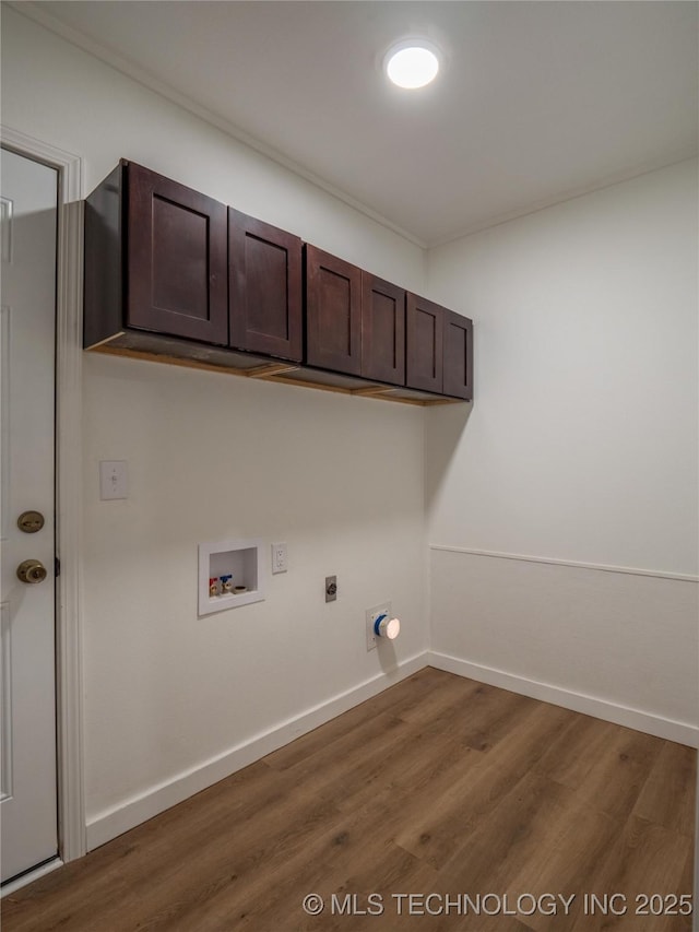 laundry area with washer hookup, wood finished floors, baseboards, cabinet space, and electric dryer hookup