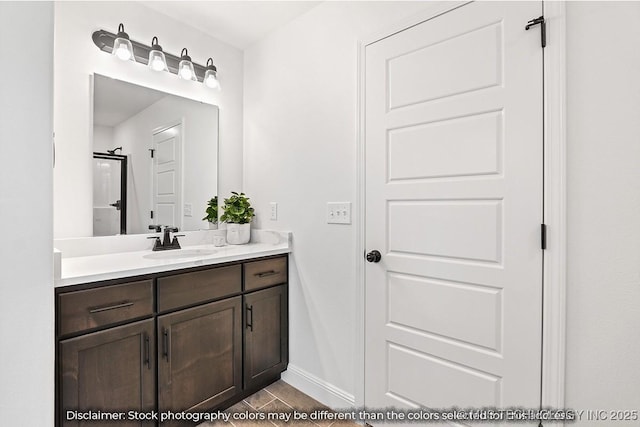 bathroom with baseboards and vanity