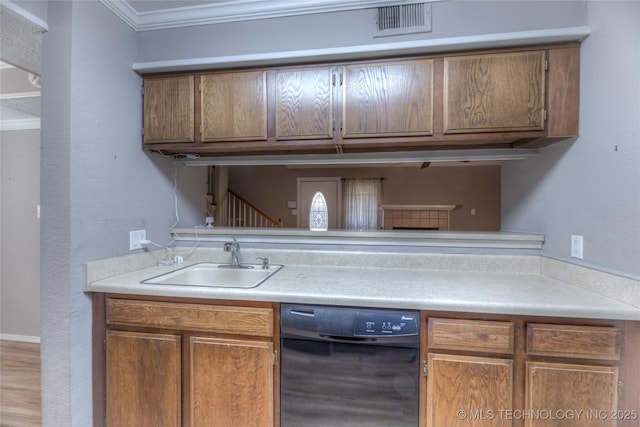 kitchen with a sink, light countertops, ornamental molding, dishwasher, and brown cabinetry