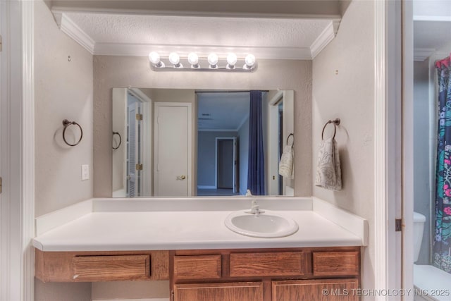 full bathroom featuring a textured ceiling, ornamental molding, and vanity