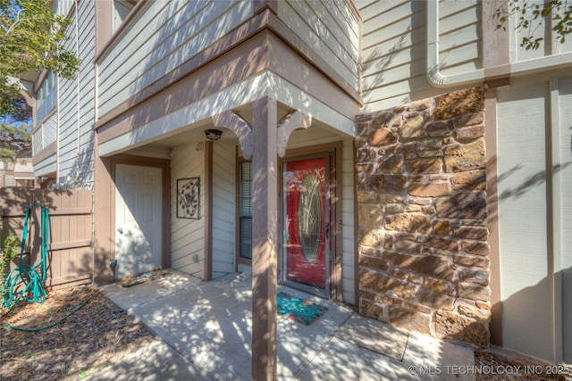 property entrance featuring fence