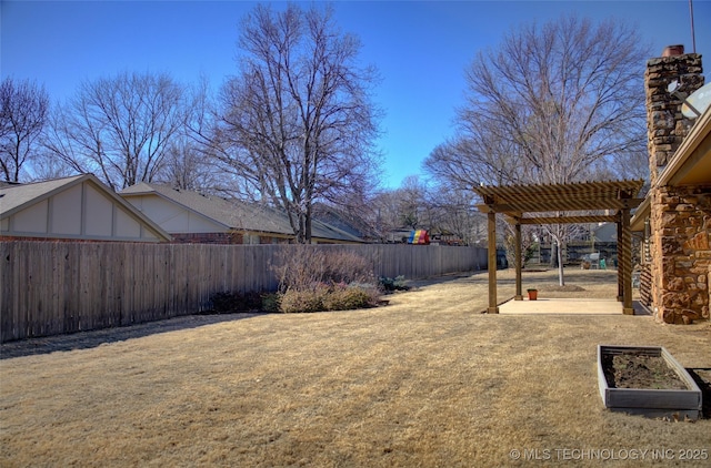 view of yard featuring a patio area, a fenced backyard, and a pergola