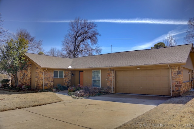 ranch-style house with an attached garage, stone siding, a shingled roof, and concrete driveway