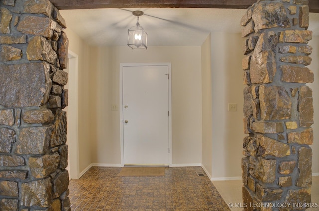 entrance foyer featuring baseboards