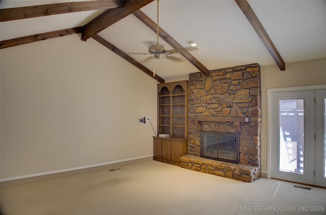 unfurnished living room featuring carpet, vaulted ceiling with beams, a fireplace, visible vents, and baseboards