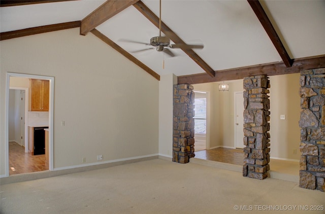 unfurnished living room featuring vaulted ceiling with beams, carpet floors, a ceiling fan, and baseboards