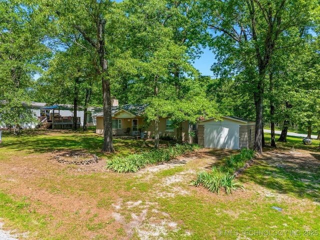 453576 Kaw Ave, Afton, OK 74331 - view of grassy yard with dirt driveway and a detached garage