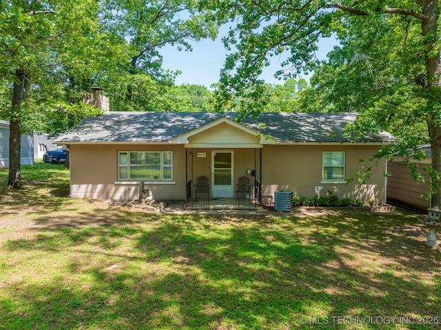 453576 Kaw Ave, Afton, OK 74331 - single story home featuring a chimney, a front lawn, covered porch, and central AC unit