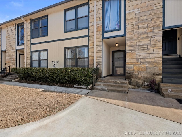 view of front of home featuring stone siding