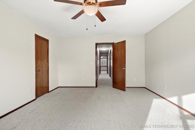 empty room with light carpet, baseboards, and a ceiling fan