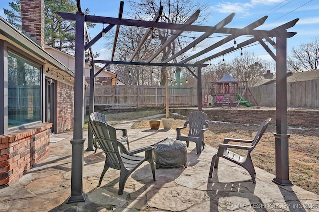 view of patio featuring a fenced backyard and a playground