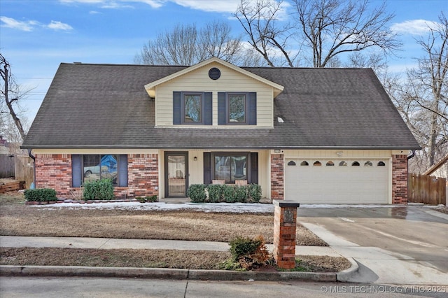 view of front facade with driveway, an attached garage, roof with shingles, and brick siding